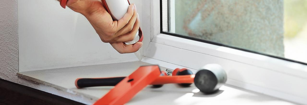 air sealing a window using a caulking gun