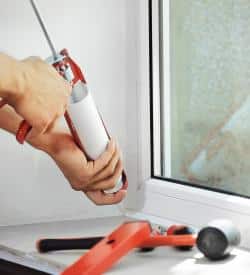 Air sealing around a home window to stop drafts and air leaks