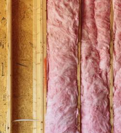 Wall insulation being installed inside a home